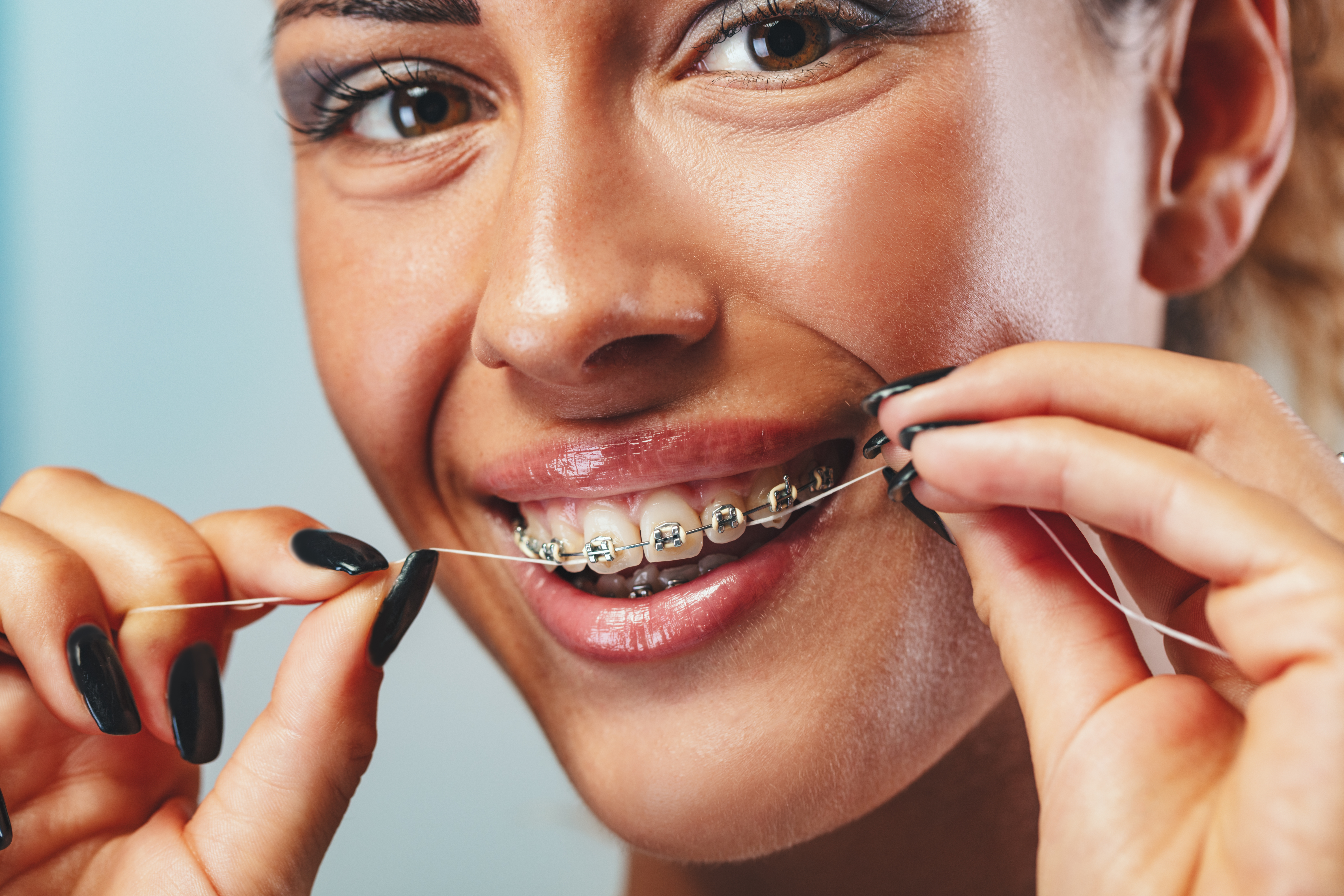 Bailey Orthodontics cleaning teeth with braces Bountiful UT